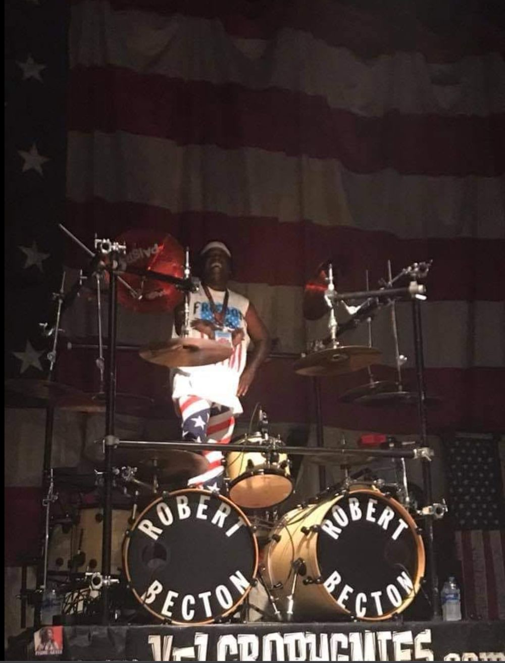 Drum kit with Robert Becton bass drum heads and a Velcro Pygmies banner